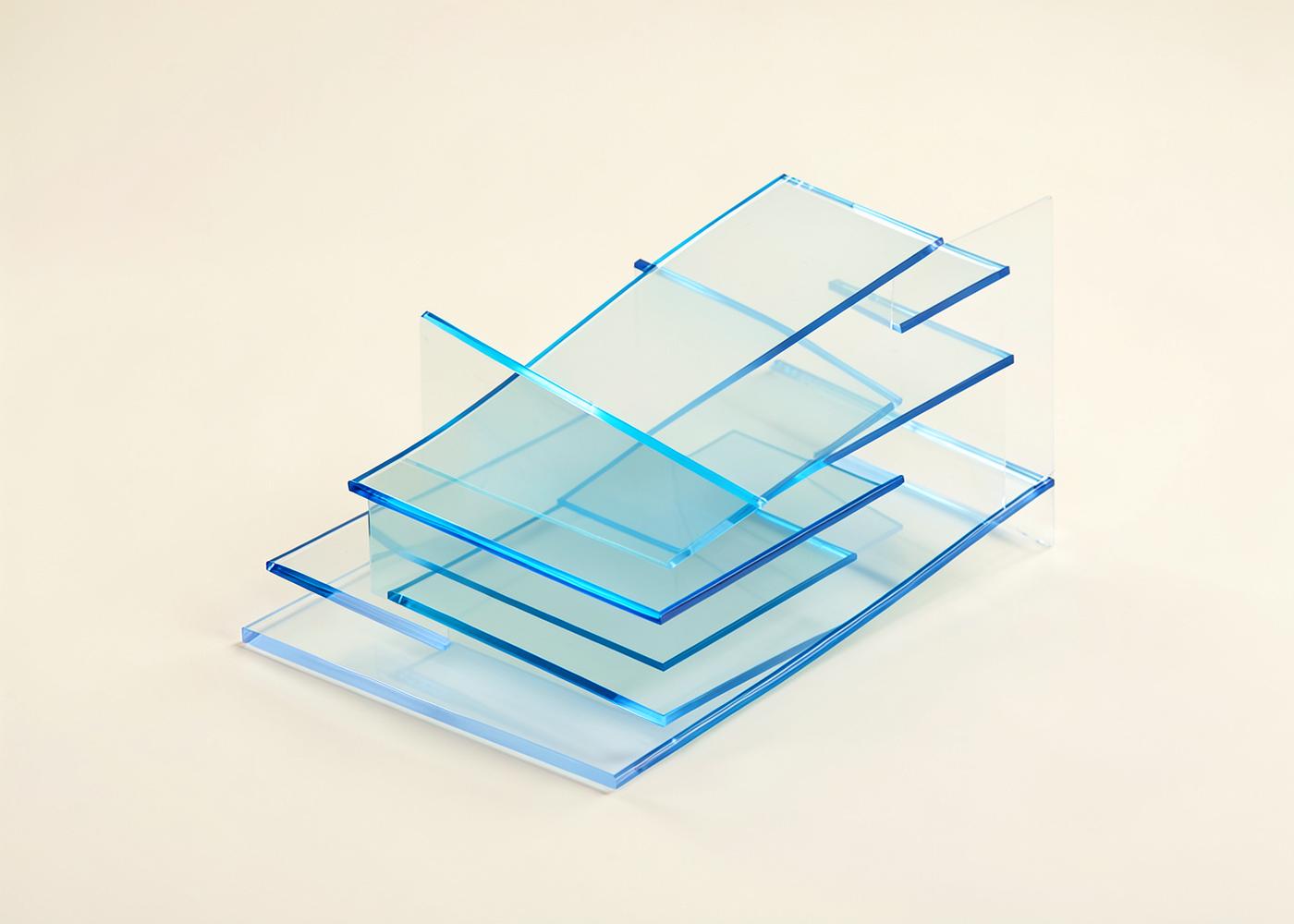 Abstract computing concept: layered translucent blue glass planes arranged as a stepped system architecture